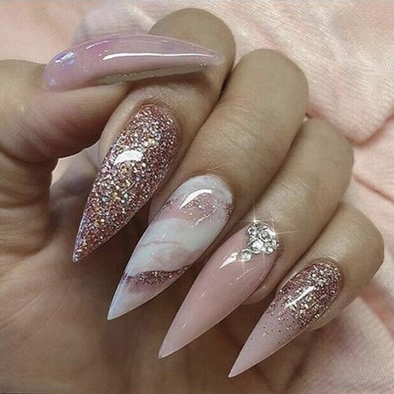Long pointed nail with matte marble pattern and sparkling pink dot diamond nail art