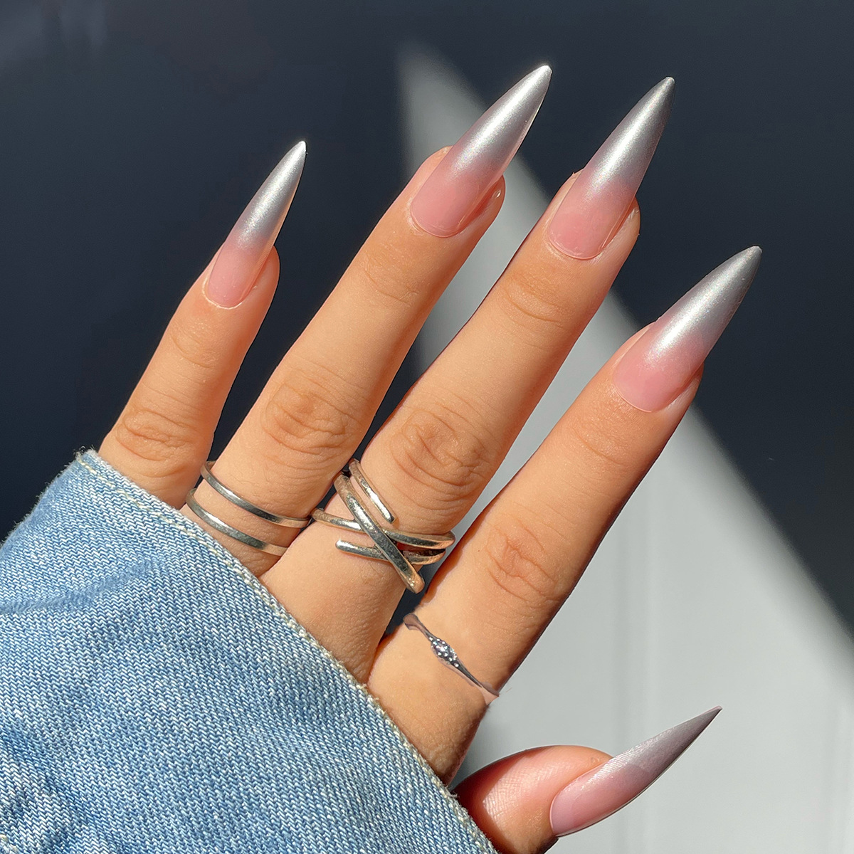 Silver gradient long pointed nail with jelly color transparent powder and white wearing armor